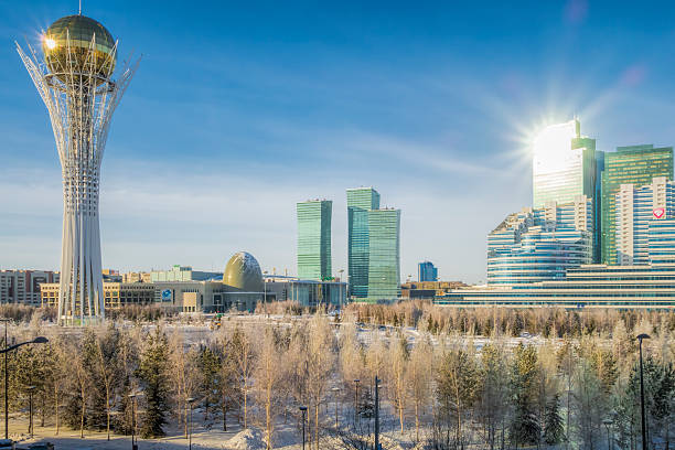 Astana, Kazakhstan - January 06, 2015: Kazakhstan Astana Baytrek - cityscape/downtown in the morning with sunlight reflection in winter. 