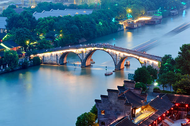 Hangzhou canal gongchen bridge at dusk Hangzhou， China-  July 11，2014: China's grand canal gongchen bridge at dusk the beauty of the scene, in June this year, China's grand canal to apply for world cultural heritage succeed grand canal china stock pictures, royalty-free photos & images