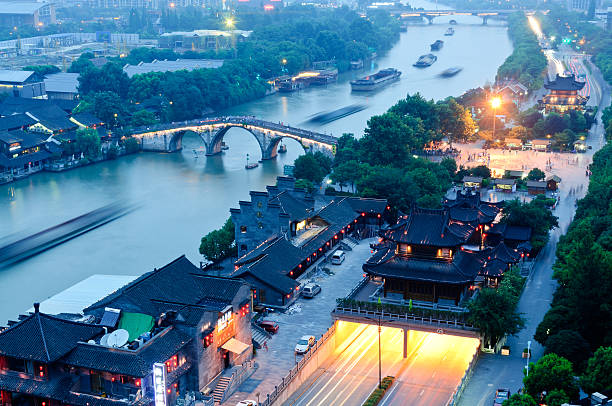 Hangzhou canal gongchen bridge at dusk Hangzhou， China-  July 11，2014: grand canal gongchen bridge at dusk the beauty of the scene, in June this year, China's grand canal to apply for world cultural heritage succeed grand canal china stock pictures, royalty-free photos & images