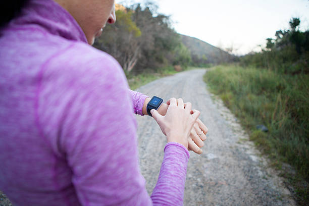 istock Woman getting her smart watch ready before jogging 531401812