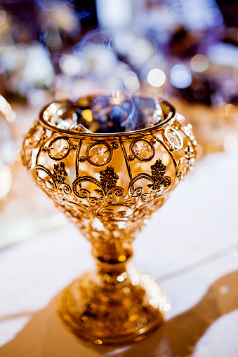 Wedding parfume  table arrangment. Arabian gold coal censer