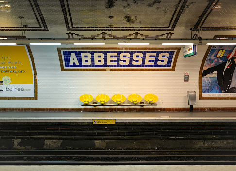 Paris, France - April 1, 2015: There is no waiting passengers at Abbesses station since the train just left. This subway station is the deepest station in Paris, France.