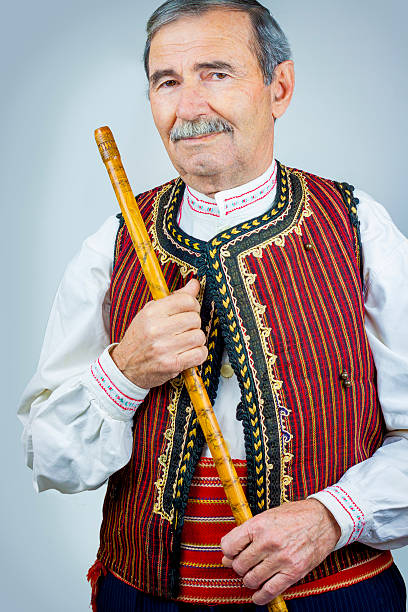istock Pipe player in traditional clothing 531404391