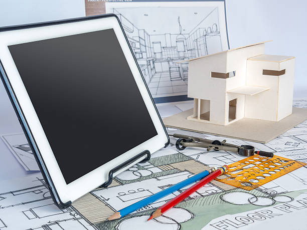 istock Architects workspace  with tablet, house model, drawing/ Home renovation concept 531404774