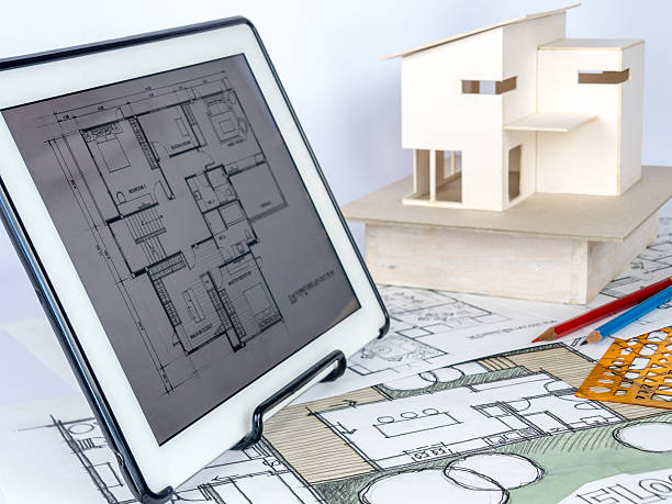 istock Architects workspace  with tablet, house model, drawing/ Home renovation concept 531405520