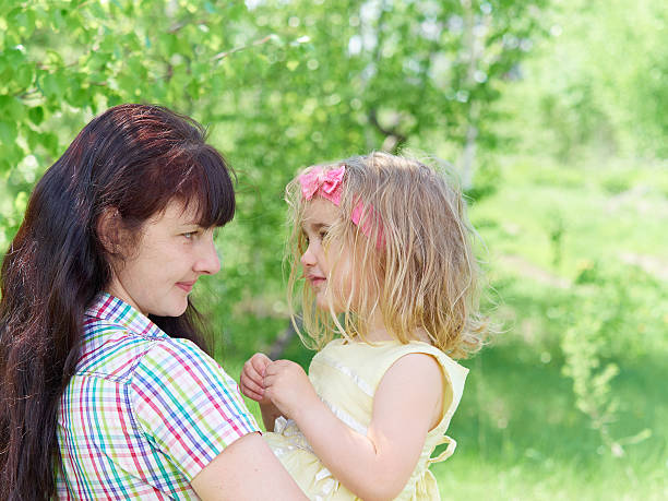 istock mother playing with her  little daughter on nature 531409748