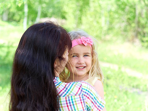 istock mother playing with her  little daughter on nature 531409796
