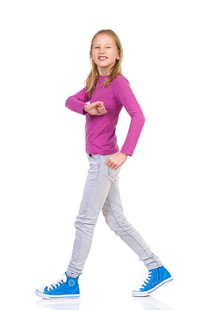 istock Smiling girl walking 531413589