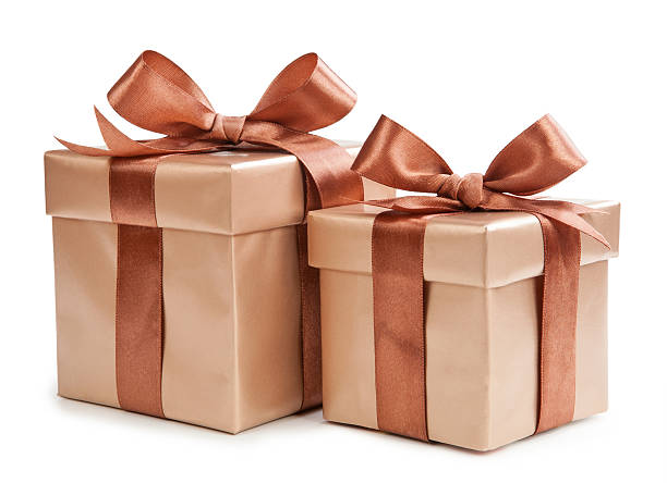 istock Gold box with gifts and brown bow 531413931