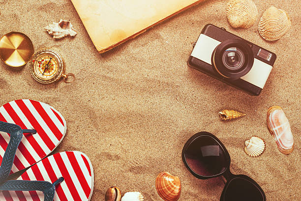 Beach ready, summer holiday vacation accessories on sandy beach