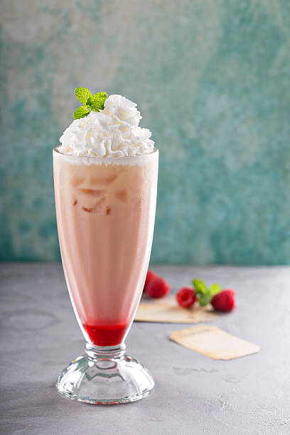 istock Iced milkshake with raspberry syrup and whipped cream 531415008