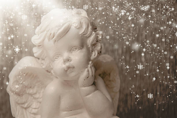 istock Little white angel on a silver background. 531415092