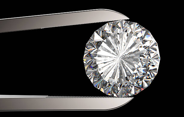 istock Diamond in tweezers 531416215