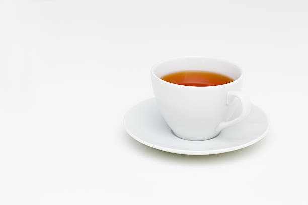 istock Classic white cup of black tea on white table 531417005