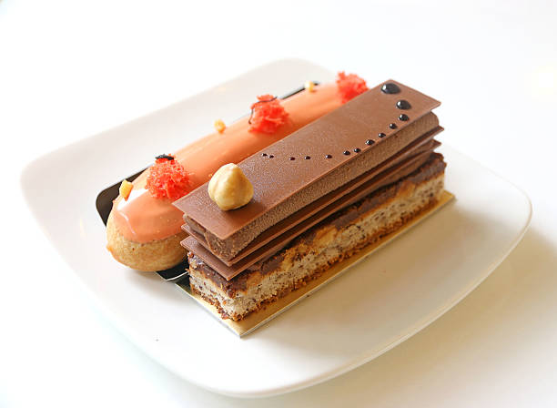 A piece opera chocolate cake and Thai tea eclairs