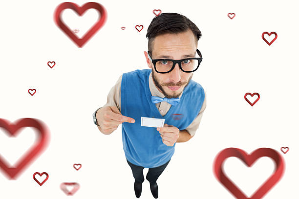 istock Composite image geeky hipster looking at camera pointing at card 531418219