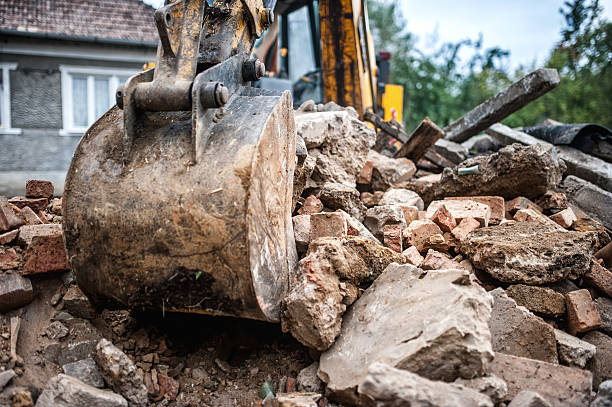 istock industrial hydraulic backhoe bulldozer loading demolition debris, stone and concrete 531418271