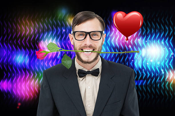 istock Composite image of geeky hipster holding rose between teeth 531418755
