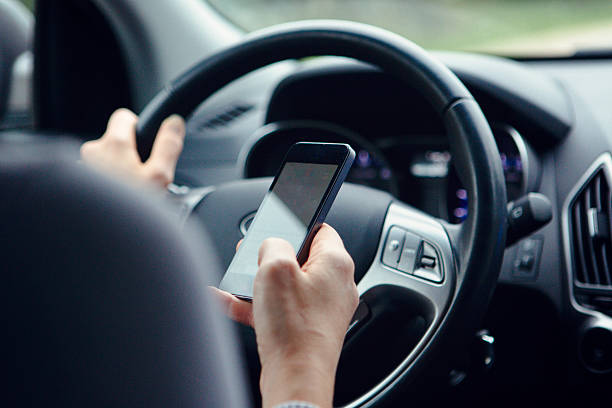 istock Woman Texting and driving. 531420283