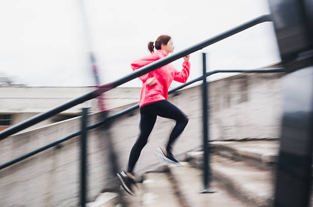 istock Young woman running 531423410