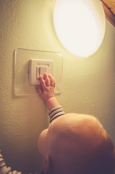 istock Baby child switching on / off the light 531423476