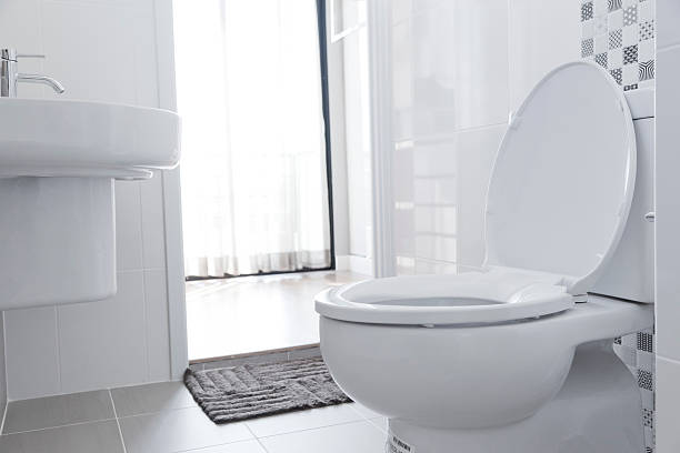 White toilet in home White toilet with water closet look outside toilet stock pictures, royalty-free photos & images
