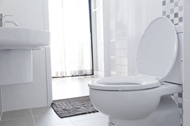 White toilet in home White toilet with water closet look outside flushing toilet stock pictures, royalty-free photos & images