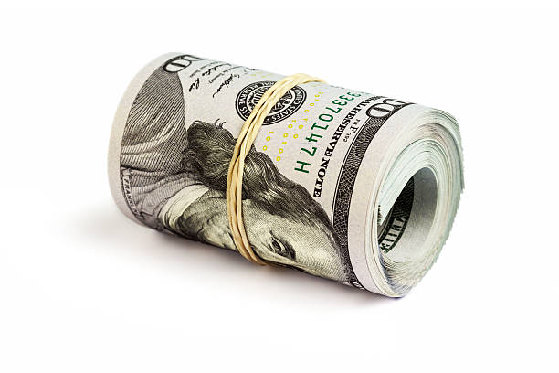 istock Roll of  hundred dollar bills isolated 531425005