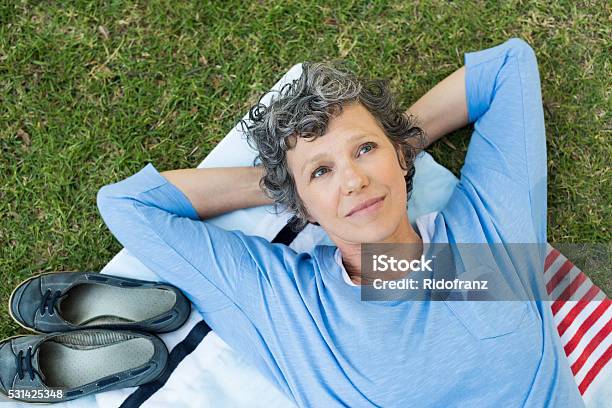 Pensive Woman In Park Stock Photo - Download Image Now - Contemplation, Senior Adult, Mature Women