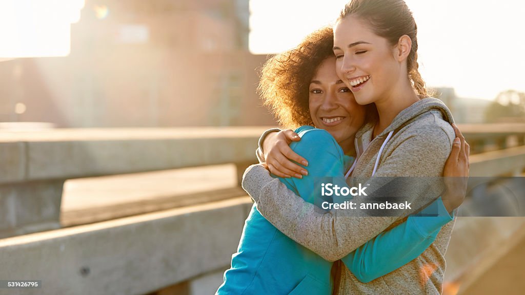 Even jogging is awesome when we do it together Portrait of two female joggers hugging each other and laughing before a run through the cityhttp://195.154.178.81/DATA/istock_collage/0/shoots/784880.jpg Hood - Clothing Stock Photo