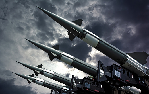 Antiaircraft rockets on the launcher against dramatic sky..