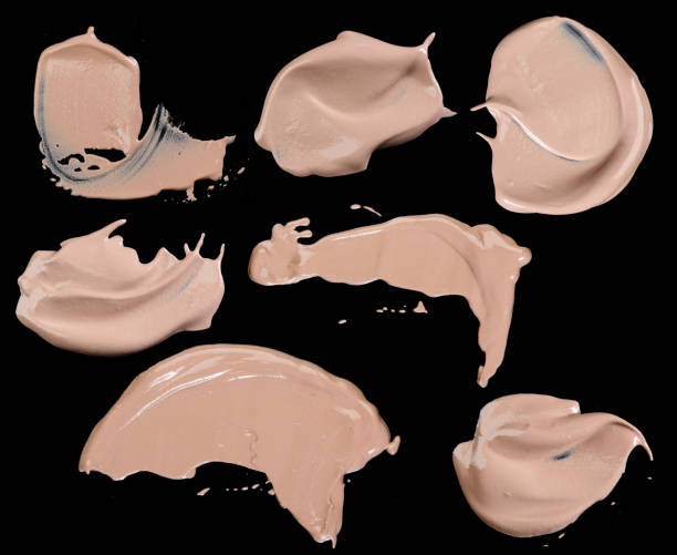 istock Various make up liquid powder strokes on black background 531427617
