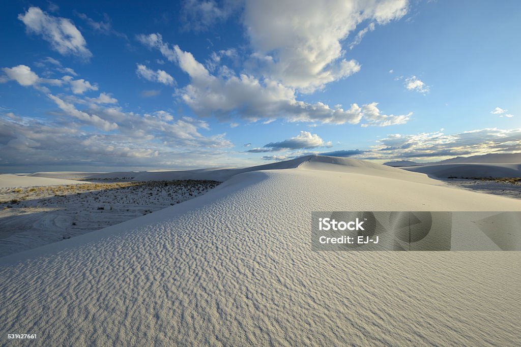 Sand Dune Patterns and Dramatic Blue Sky Blue sky and late afternoon sun at White Sands National Monument, New Mexico. White Sands National Park Stock Photo