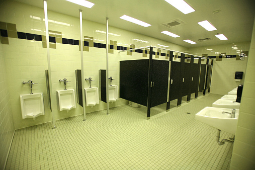 Urinals, Bathroom, Restrooms and Lavatory Stalls in Fluorescent Light