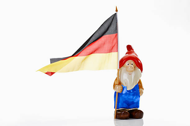 Garden gnome and german flag on white background