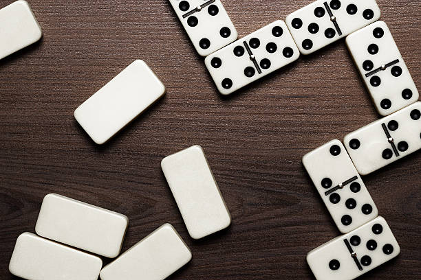 istock domino pieces on the wooden table background 531428357