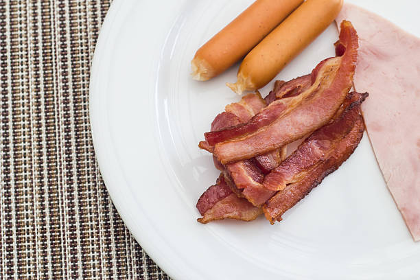 istock Breakfast style sausage and bacon with ham 531429909