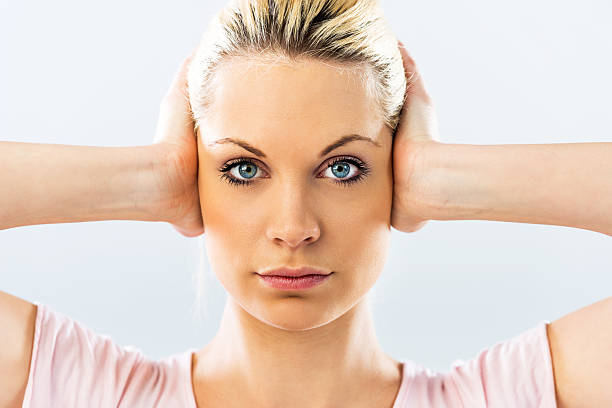 istock Woman covering her ears. 531430495
