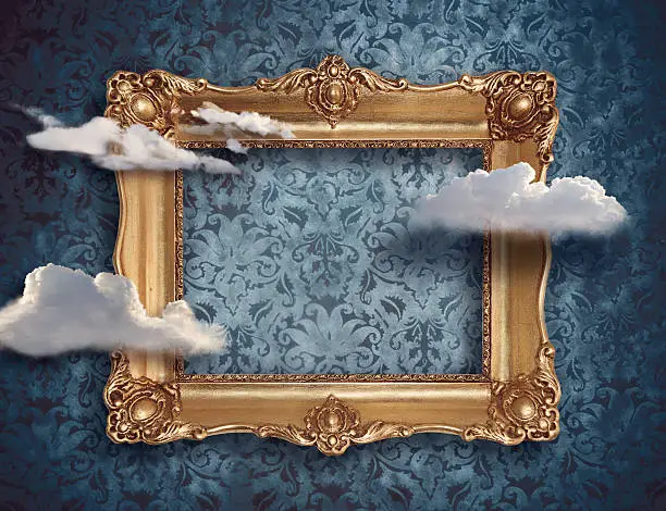 Photo of Retro gold frame and clouds. Surreal concept digitalart.