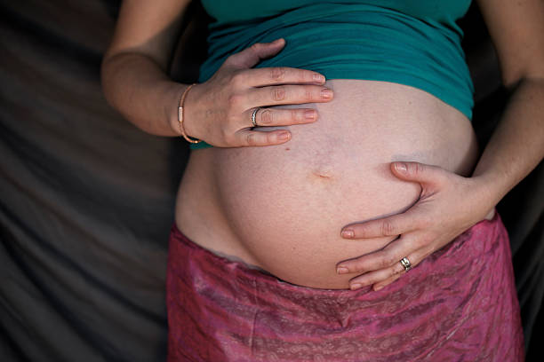istock Pregnant woman holds her belly. 531439633