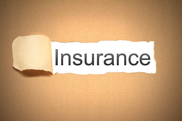 istock brown paper torn to reveal insurance 531439855