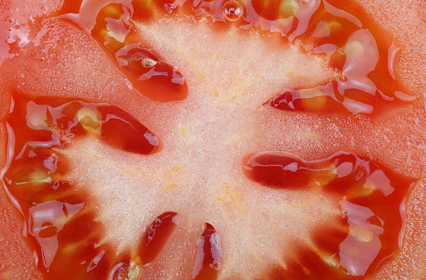 istock Close-up fresh natural tomato macro to background 531442401