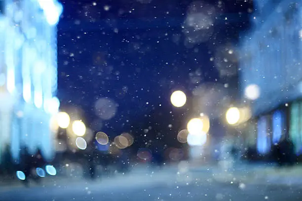 Photo of city ​​night winter snow blurred background