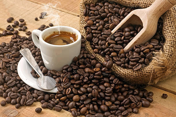 istock coffee cup and grains on wooden table 531445809