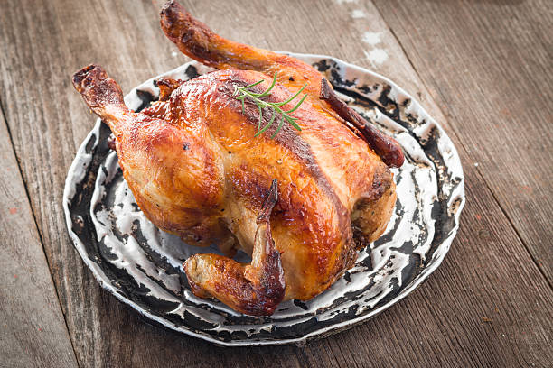 istock whole roasted chicken on wood 531446625