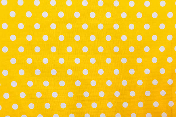 istock Yellow and white polka dots tablecloth picnic texture. 531454956