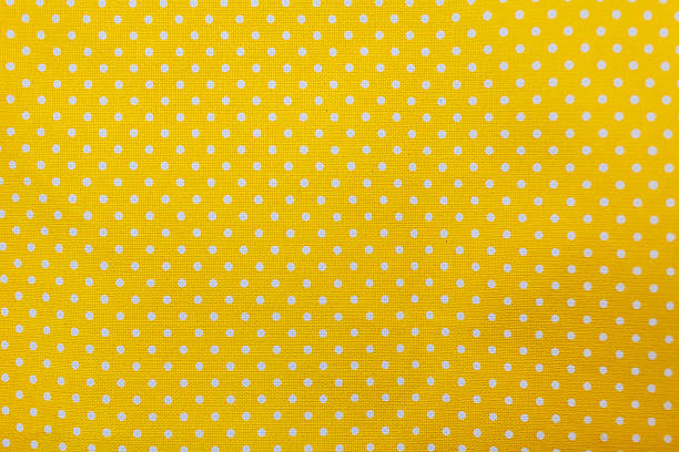 istock Yellow and white polka dots tablecloth picnic texture. 531455034