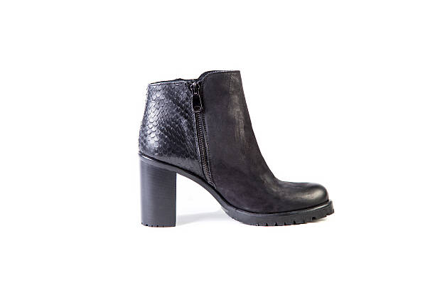 istock Suede women's boots on a white background, black shoes 531455798
