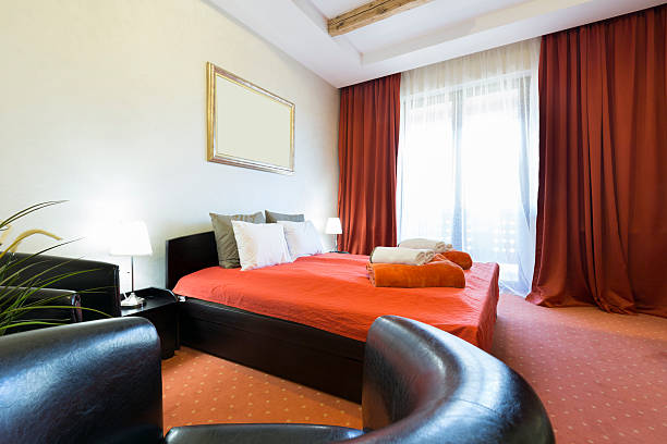 istock Hotel bedroom interior lit by the morning sun 531457914