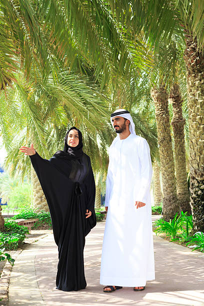 istock Middle Eastern couple walking on trail in the park 531458106